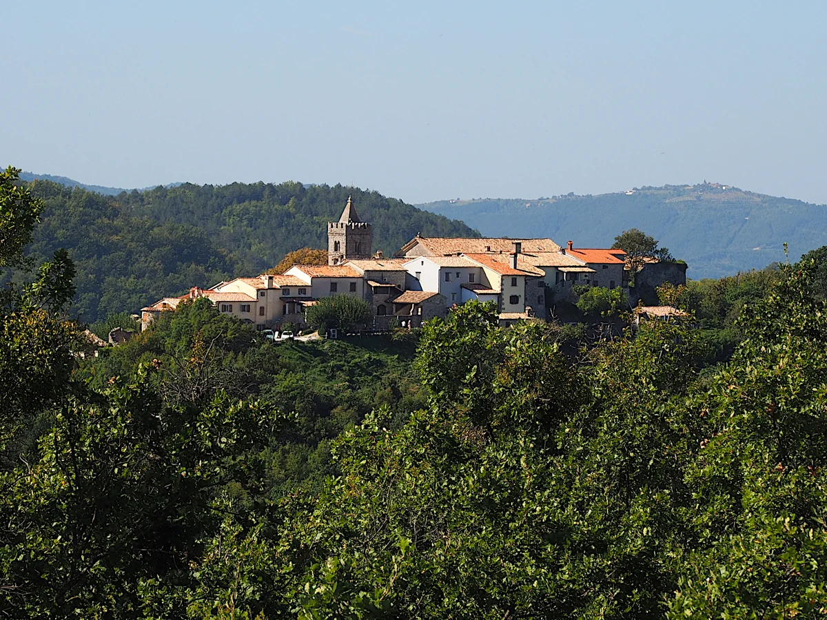 Hum surrounded by wooded hills in inland Istria